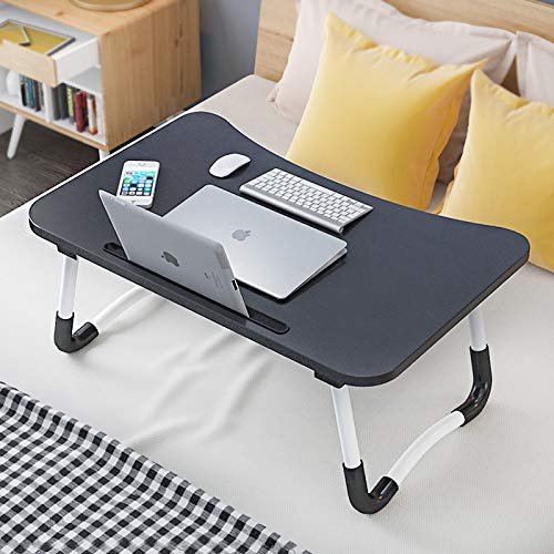 Tarkan foldable wooden laptop table is the best laptop for bed under 1000.